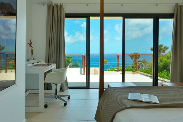 bedroom 01 desk ocean view at Villa Enzuma