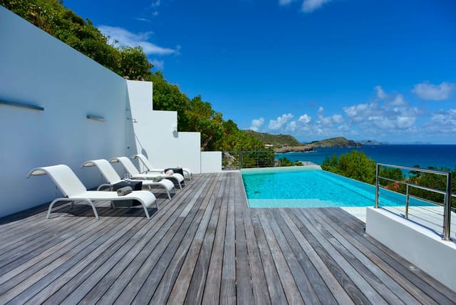 deck pool chairs ocean view at Villa Matajagui