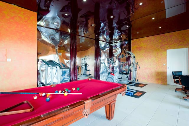 fitness and pool table room at Villa Ushuaia